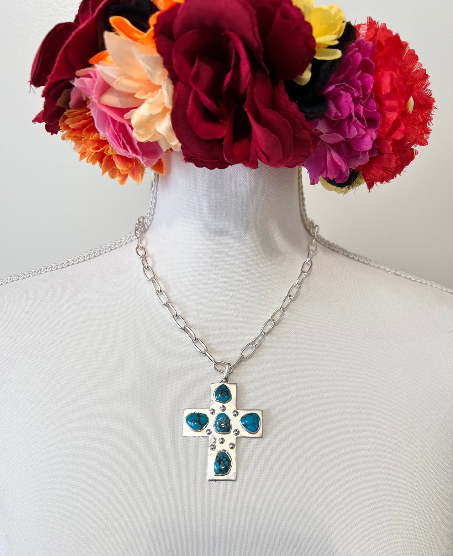 Silver cross necklace.
