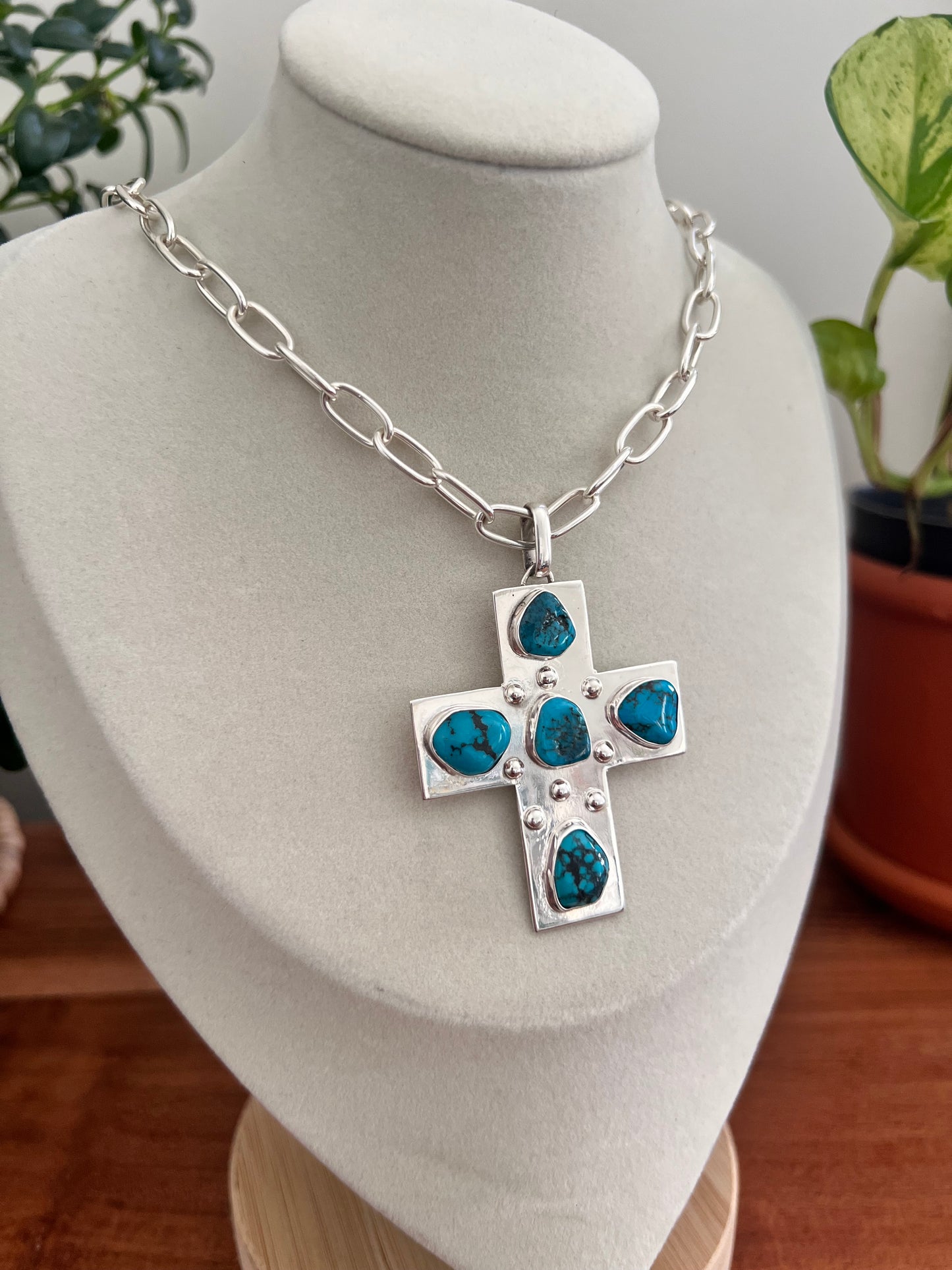 Silver cross necklace.