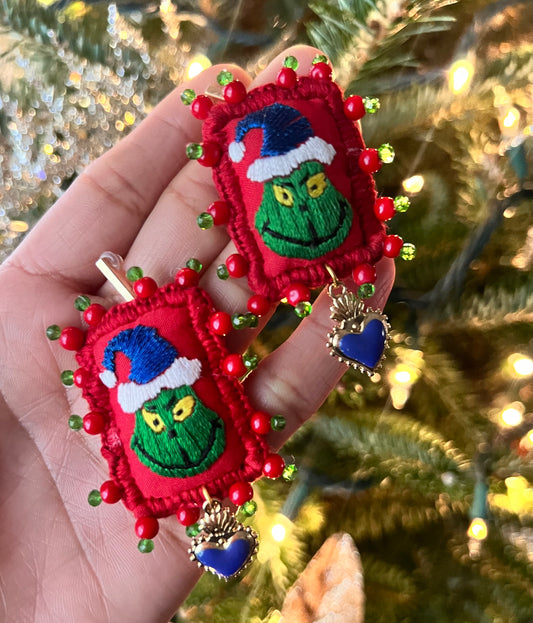 Grinch earrings.