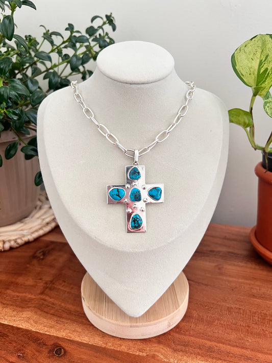 Silver cross necklace.